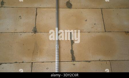 Plaster Guide on an Aerated Concrete Wall Stock Photo