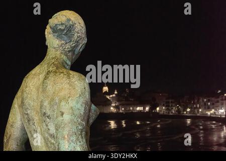 Sitges. Spain - March 05, 2026: Artistic perspective of the Dona Mediterrania monument by Lluisa Granero overlooking the dark Mediterranean waters and Stock Photo