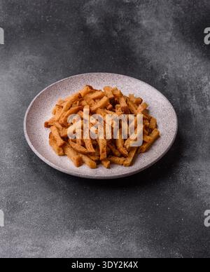Croutons or crackers made from rye bread with garlic, salt, and spices, a salad ingredient. Croutons with salt and garlic as a food background for you Stock Photo