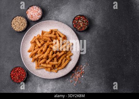 Croutons or crackers made from rye bread with garlic, salt, and spices, a salad ingredient. Croutons with salt and garlic as a food background for you Stock Photo