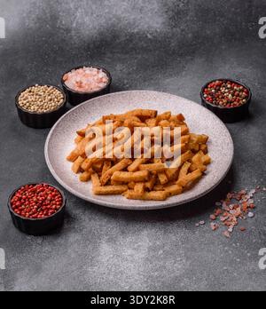 Croutons or crackers made from rye bread with garlic, salt, and spices, a salad ingredient. Croutons with salt and garlic as a food background for you Stock Photo