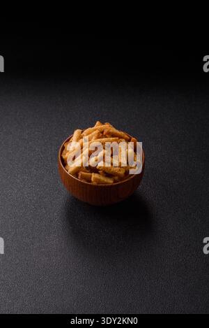 Croutons or crackers made from rye bread with garlic, salt, and spices, a salad ingredient. Croutons with salt and garlic as a food background for you Stock Photo