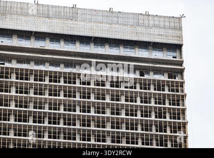 Concrete high rise building under construction creating urban development and growth Stock Photo