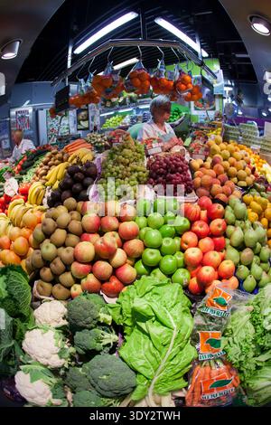 Healthy food. Broccoli displays vibrant green color on a wooden cutting ...