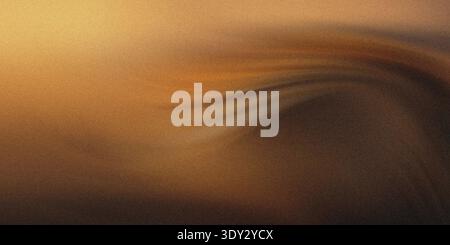 Abstract swirling pattern of warm golden and dark brown tones, evoking a sense of cosmic dust or flowing sand with a subtle grainy texture Stock Photo