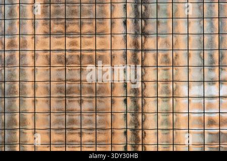 Textured wired glass surface creating an abstract grid pattern background Stock Photo