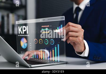 Business KPI concept. Professional businessman using a laptop to analyze key performance indicators on a digital dashboard, with financial charts, Stock Photo