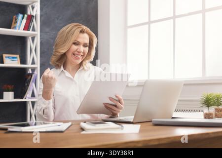 Business woman enjoying successful project Stock Photo