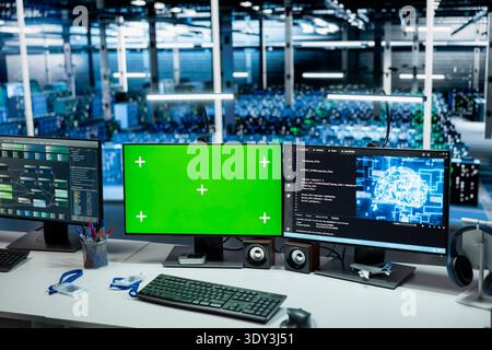 Data center mockup isolated screen PCs monitoring AI LLM models performance used in automation workloads. Green screen chroma key computers overseeing artificial intelligence server rigs Stock Photo