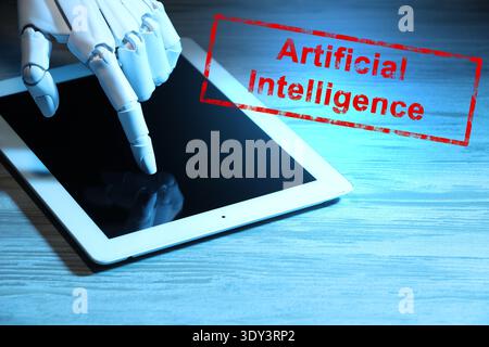 Robot using tablet computer. Red stamp Artificial Intelligence Stock Photo