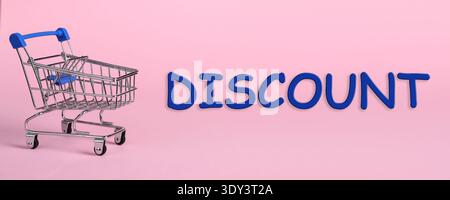 Discount flyer or poster design with shopping cart on pink background Stock Photo