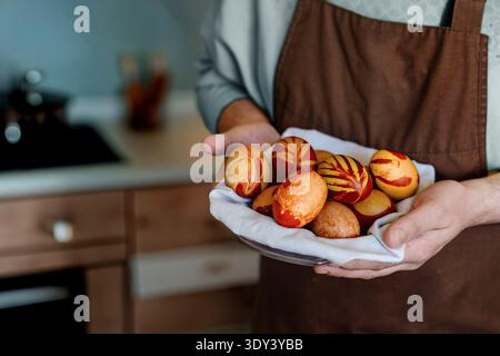 Easter eggs decorated handmade natural dyes onion peel tradition decorative pattern hands white bowl homemade celebration spring holiday festivity apr Stock Photo