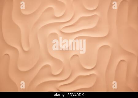 Wavy peach background creating a soft flowing abstract texture pattern Stock Photo