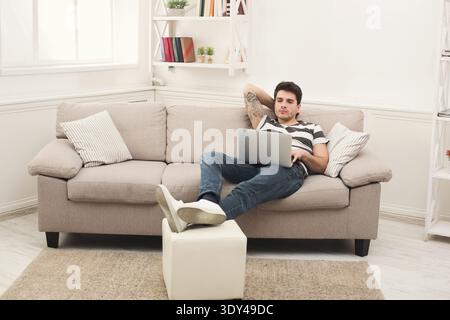 Happy man win. Winner, young man with laptop Stock Photo