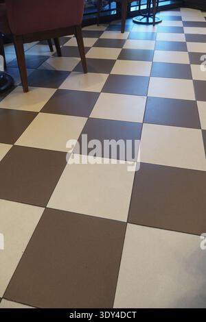 Checkered tiles in a cafe during daytime hours Stock Photo