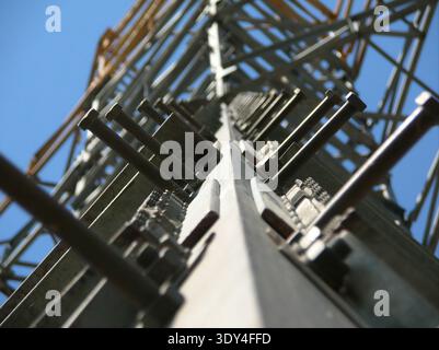 Detailed engineering view of industrial bolts and nuts on galvanized steel Stock Photo