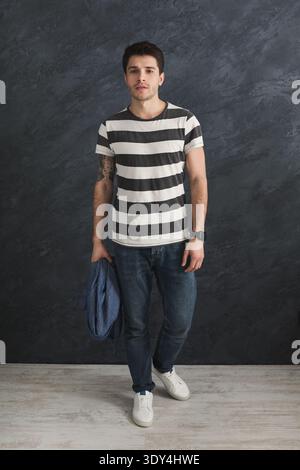 Handsome stylish man posing in studio Stock Photo