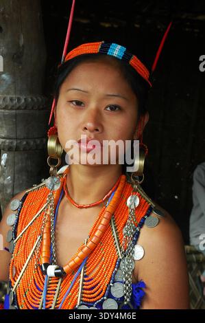 –Ungma, Mokokchung, Nagaland,India - A Naga woman with traditional dress. Nagaland is a hill state located in the far north-eastern part of India.Nagaland inhabited by the Naga tribes, captured international attention during world war 2, because it was here that the Japanese advance was halted by British and Indian troops. After India’s independence, Nagaland became a state in 31 December 1963. Nagaland is known as "The most populated Baptist state in the world". The state's population is 1.988 million, out of which 90.02% are Christians.The Naga people belong to the Mongoloid group. Majority Stock Photo