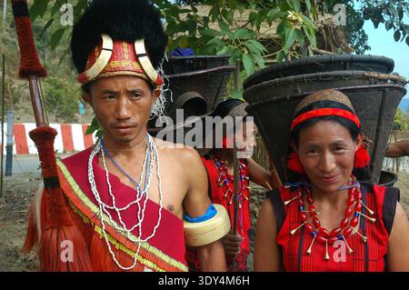Kisima,Kohima, Nagaland,India - Naga couple traditional dress. Nagaland is a hill state located in the far north-eastern part of India.Nagaland inhabited by the Naga tribes, captured international attention during world war 2, because it was here that the Japanese advance was halted by British and Indian troops. After India’s independence, Nagaland became a state in 31 December 1963. Nagaland is known as "The most populated Baptist state in the world". The state's population is 1.988 million, out of which 90.02% are Christians.The Naga people belong to the Mongoloid group. Majority of the Naga Stock Photo