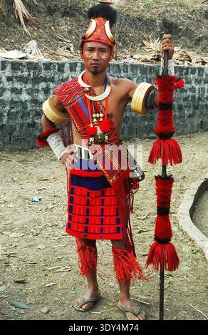 Kisima,Kohima, Nagaland,India - A young Naga with their traditional dress. Nagaland is a hill state located in the far north-eastern part of India.Nagaland inhabited by the Naga tribes, captured international attention during world war 2, because it was here that the Japanese advance was halted by British and Indian troops. After India’s independence, Nagaland became a state in 31 December 1963. Nagaland is known as "The most populated Baptist state in the world". The state's population is 1.988 million, out of which 90.02% are Christians.The Naga people belong to the Mongoloid group. Majority Stock Photo