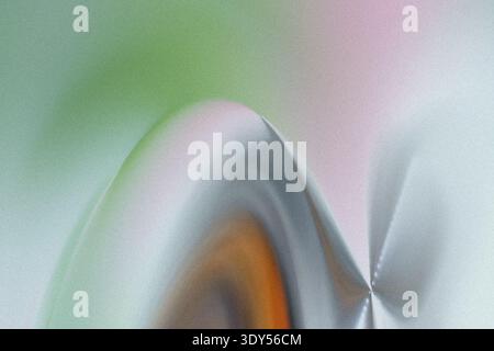 Abstract blurry background featuring mixed colors of green orange white and a hint of pink in soft focus Stock Photo