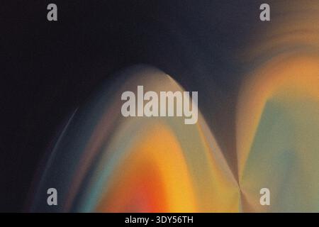 Abstract blurred background featuring a gradient of colors with orange yellow and dark blue hues blending softly Stock Photo