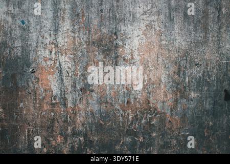 Dark grunge concrete wall texture with rusty orange stains and weathered surface Stock Photo