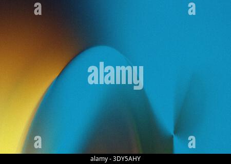 Abstract background featuring a blend of blue and yellow colors creating a soft and blurred effect Stock Photo