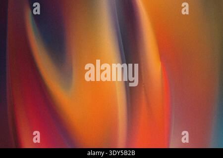 Abstract art with vibrant orange hues blending seamlessly into dark blue and red tones creating a flow Stock Photo