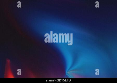 Abstract blurred background featuring gradients of deep blue and red colors creating a soft effect Stock Photo
