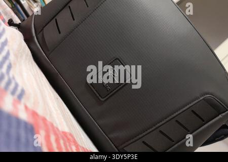 Wroclaw, Poland - December 10 2024: Nomatic Gomatic Peter McKinnon 13L Camera Messenger Bag with Magnetic Latch and Internal Organization for Mirrorle Stock Photo