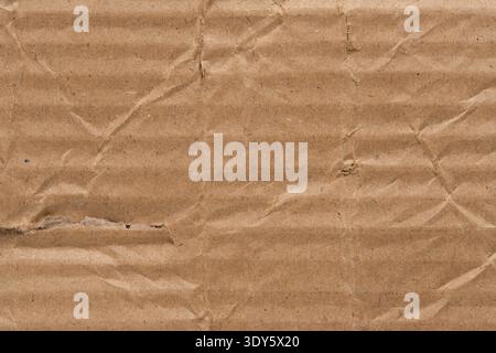 Close up old crumpled brown cardboard texture. Background for vintage or eco friendly designs Stock Photo