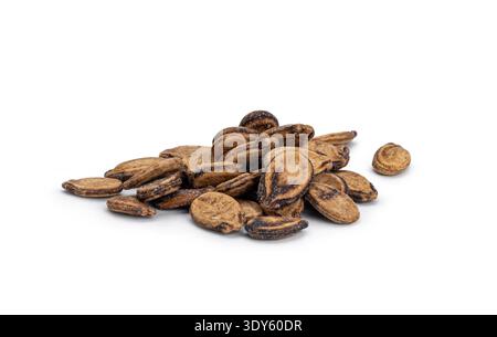 Dried watermelon seeds forming a small pile on a solid white surface Stock Photo