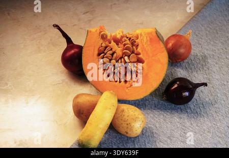 Red onion, potatoes, carrots and sliced ​​zucchini Stock Photo