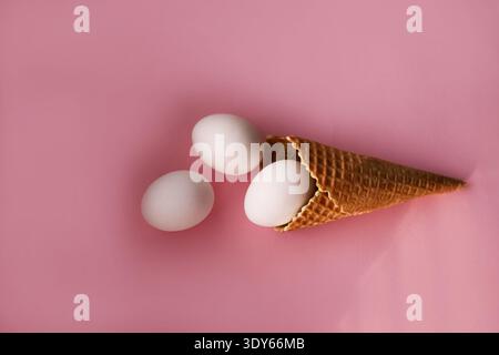 Decorative eggs placed in waffle ice cream cup Stock Photo