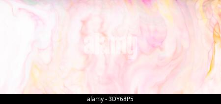 Soft pink and yellow watercolor texture with delicate pastel blending for creative backgrounds Stock Photo