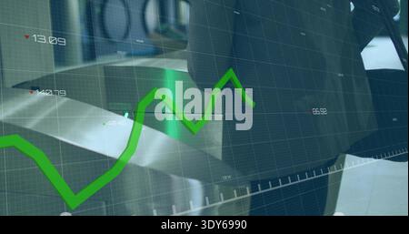 Displaying bright green line chart fluctuating across trading screen, with blue-gray grid overlay Stock Photo