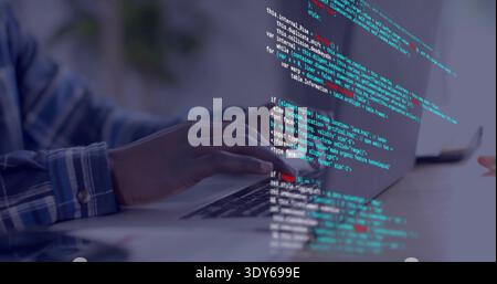 Typing developer's hands wearing blue plaid shirt pressing keys on laptop at home desk, with code Stock Photo