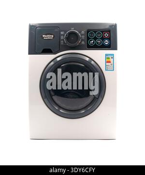 A toy washing machine for children on a white background. Realistic miniature household appliances for kids. Interactive washing machine for play. Stock Photo