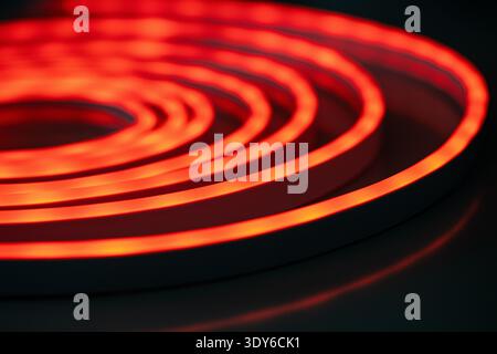 Red glowing spiral neon light abstract pattern Stock Photo