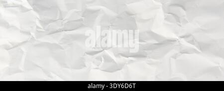 Crumpled white paper texture showing wrinkles and folds creating an abstract background Stock Photo