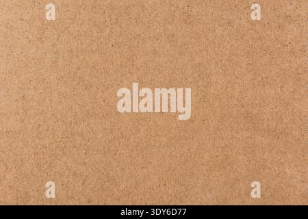 Brown recycled cardboard paper showing its rough textured and fibrous surface Stock Photo