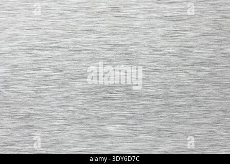 Brushed aluminum surface showing horizontal metallic lines and a silver industrial texture Stock Photo