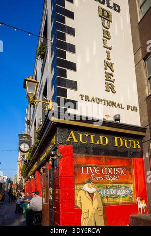 Traditional pub showcasing live music at night in Dublin's Temple Bar area often crowded with locals and tourists Stock Photo
