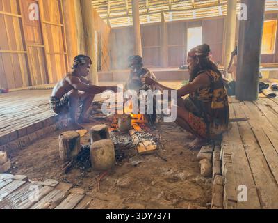 Preparing traditional chicken meal by local cooks at a community gathering in Waingapu Sumba Island, Indonesia Stock Photo