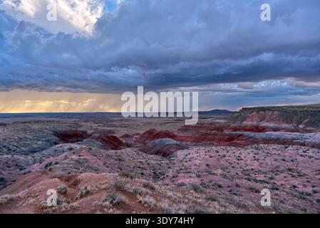 Storm clouds gather over landscape at Whipple Point in Petrified Forest National Park Arizona during afternoon hours with dramatic light Stock Photo