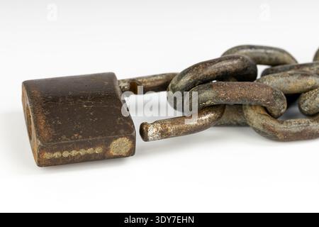A rusty chain metal padlock broken link security concept close up corrosion old lock damaged chain isolated object white background rusty chain metal Stock Photo