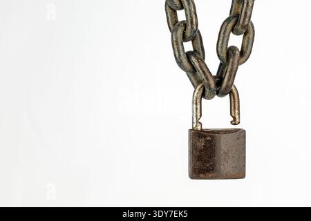 A rusty chain padlock security concept on white background minimalist metal object safety protection locked secure connection strength industrial deta Stock Photo