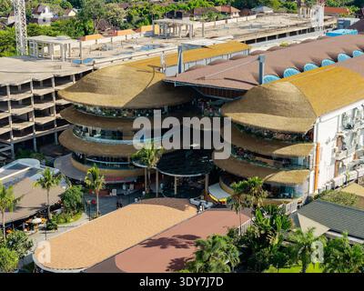 Exterior view of Icon Bali mall from Sanur beach, promotional flags and ...