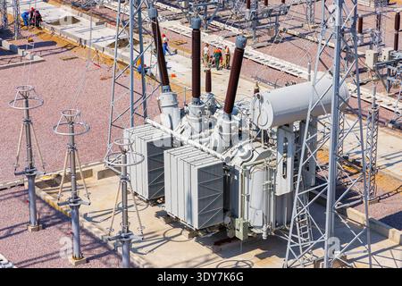 panoramic aerial view of a power transformer installed at an electrical substation, without people, during daytime Stock Photo